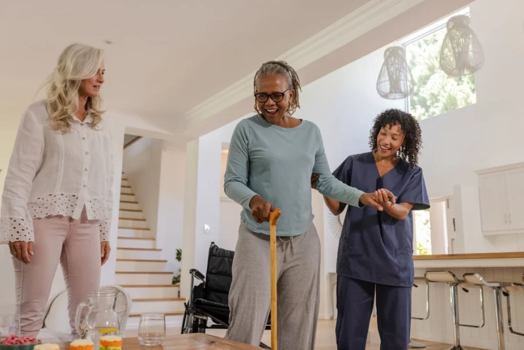 Woman with cane walking with caregiver – personal care assistance in Maryland